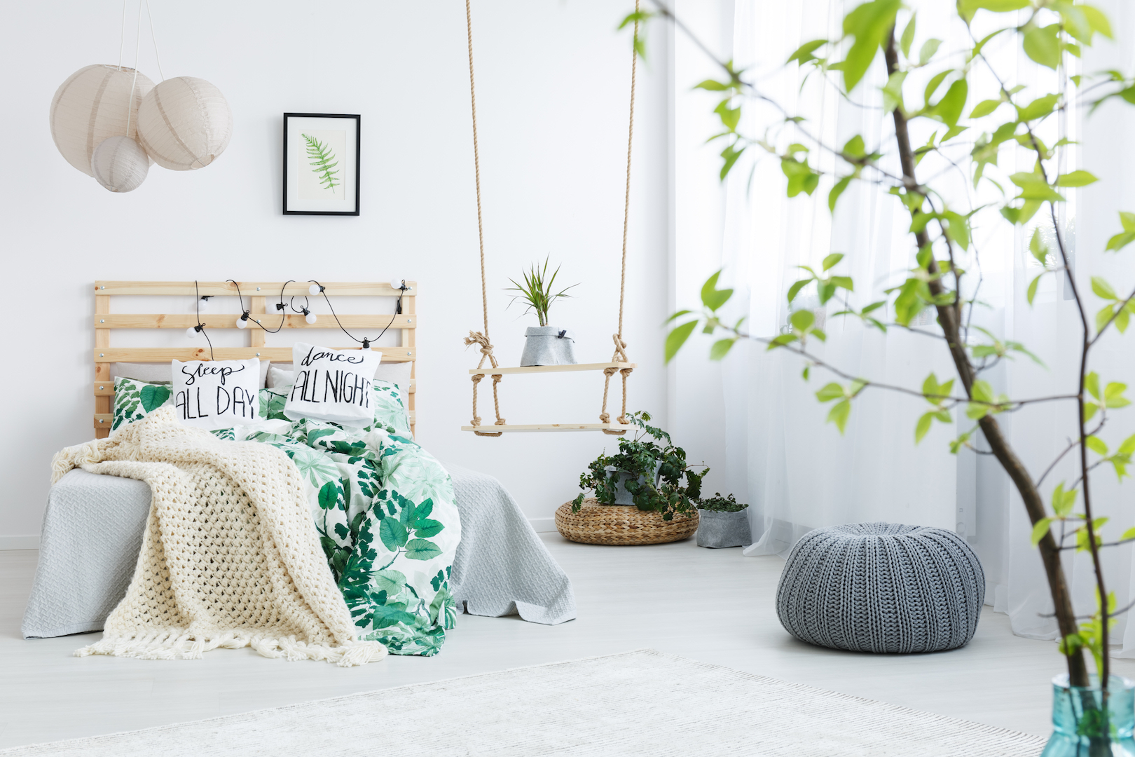 bedroom with gray pouf